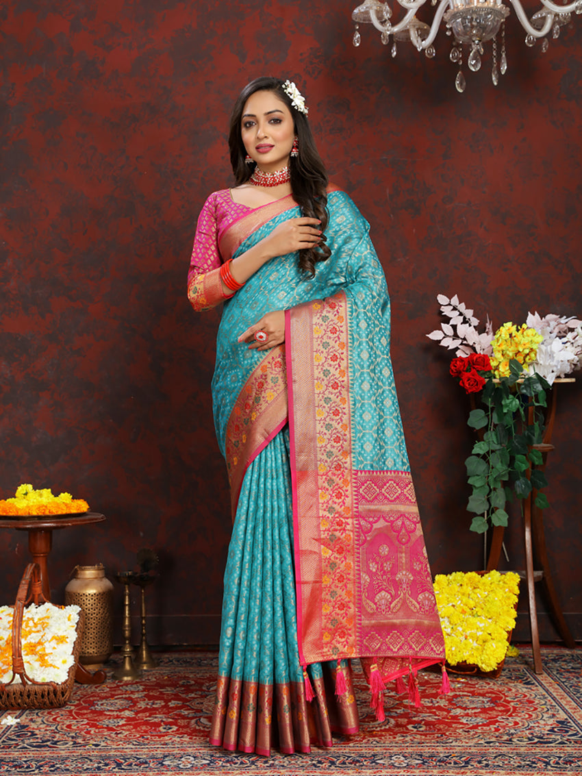 Firozi colored Organza silk saree with detailed Meenakari weaving on the pallu