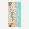 Florida themed beach towel featuring turquoise ocean waves, sandy beach, hibiscus flowers on flip-flops, and a straw hat.