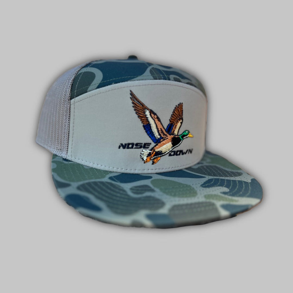 Fly High Duck 7 panel hat in green, beige, and brown camo print with adjustable snapback