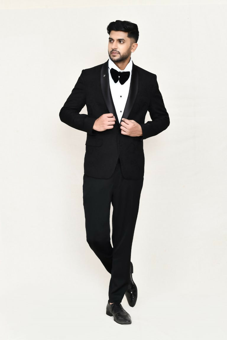 A sophisticated black satin silk coat suit set including a shirt and matching bow tie.