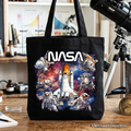 Artistic space-themed tote bag featuring an astronaut and planet design