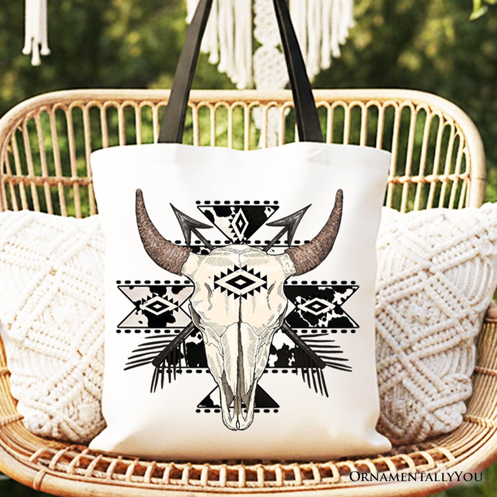 Cream canvas tote bag featuring an Aztec tribal bull skull design in black and brown.