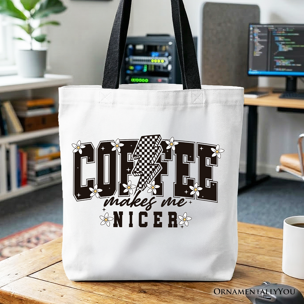 A stylish white and black retro-style cotton tote bag featuring the text Coffee Makes Me Nicer.
