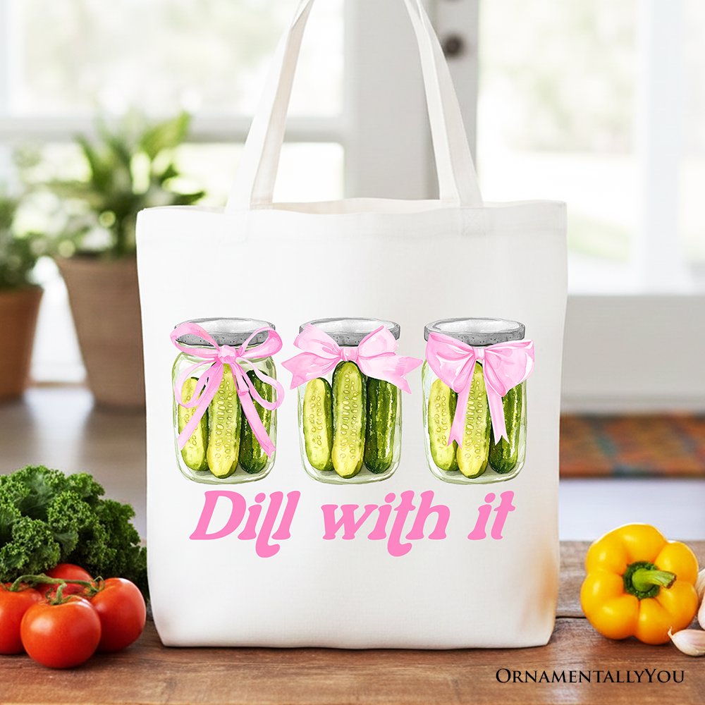 Durable canvas tote bag with a pickle graphic and a pink coquette bow, white background