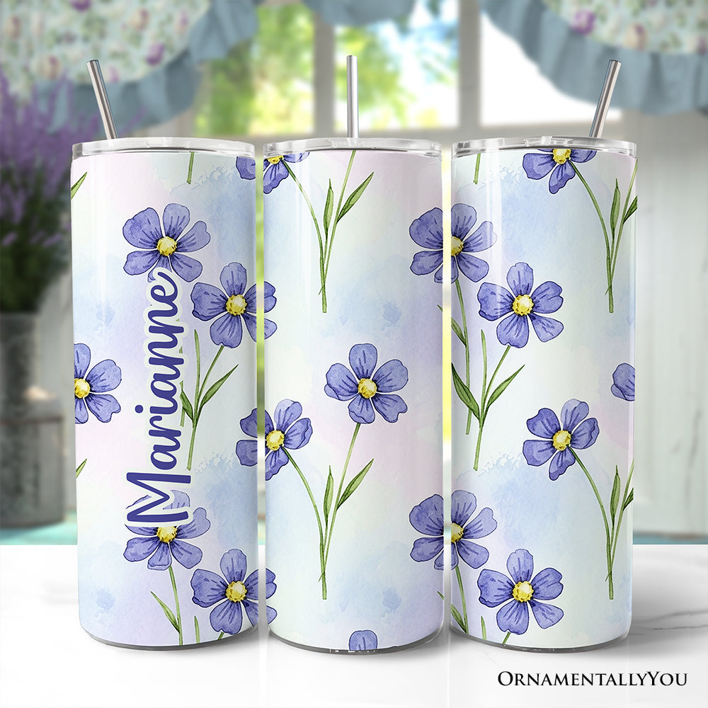 20oz stainless steel travel tumbler featuring a delicate blue wildflower floral pattern with straw.