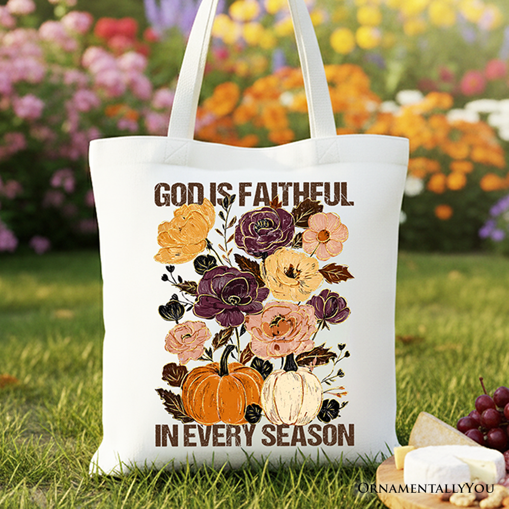 A colorful floral canvas tote bag with the text God Is Faithful in Every Season.