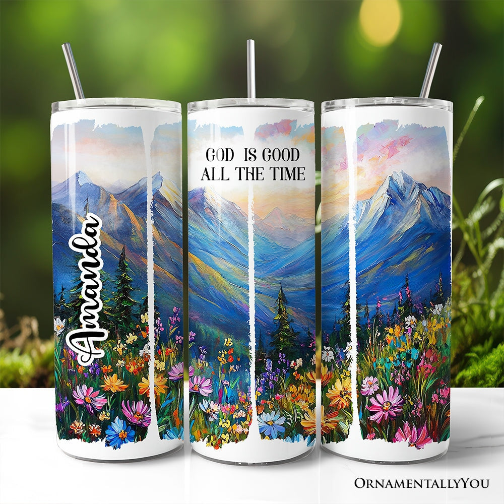 20oz tumbler featuring a mountain design with wildflower brushstrokes and God is Good text
