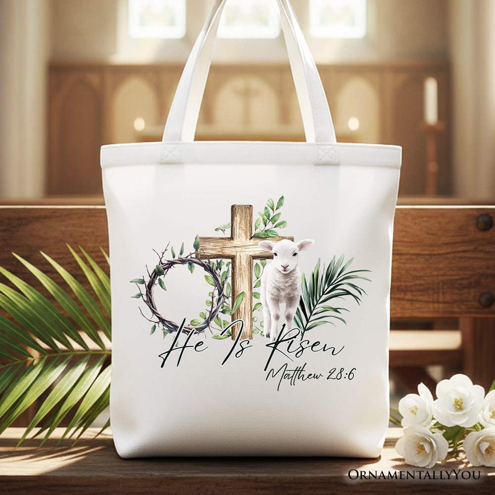 He Is Risen Lamb Cross Christian Easter Tote Bag in white, brown, and green.