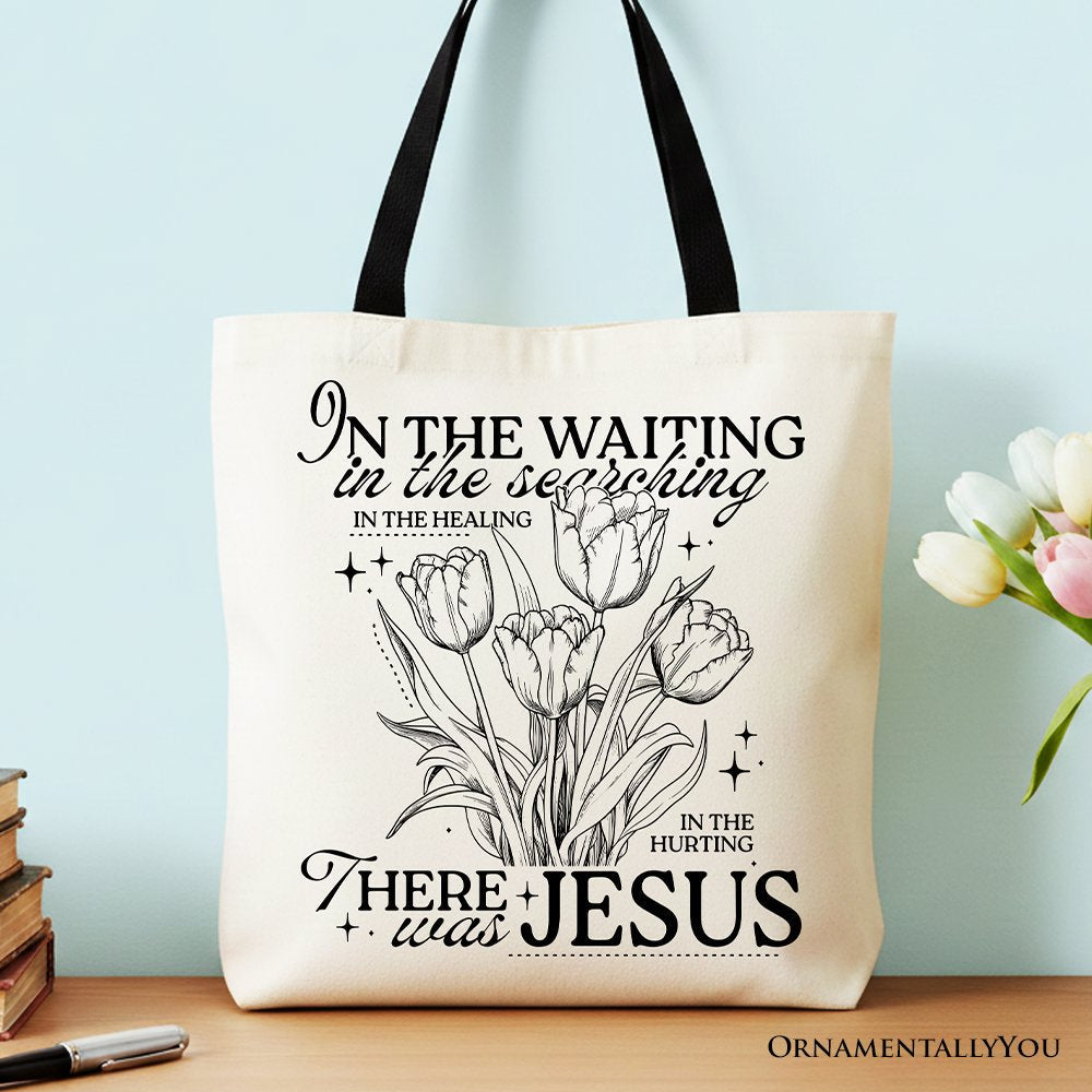 Off-white cotton tote bag with floral pattern and the text In the Waiting There Was Jesus