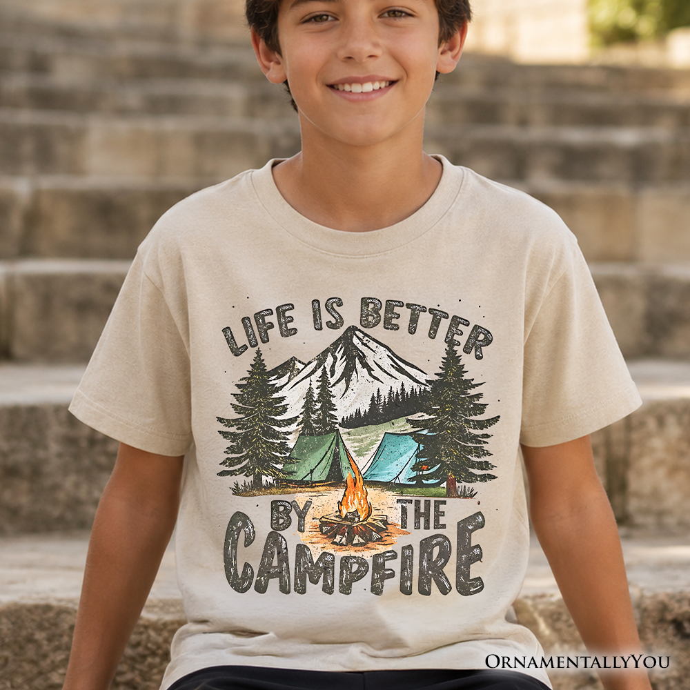 Child wearing a soft cotton Life Is Better by the Campfire graphic t-shirt in an outdoor setting.