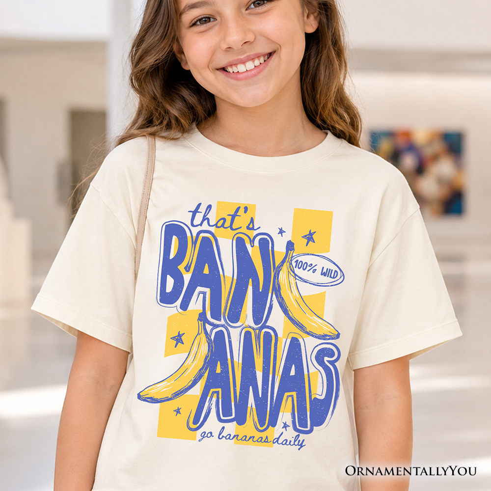 Child wearing a soft, yellow tropical print 'That's Bananas' summer t-shirt