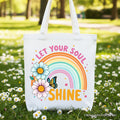 White cotton tote bag with Let Your Soul Shine text and pastel rainbow floral design