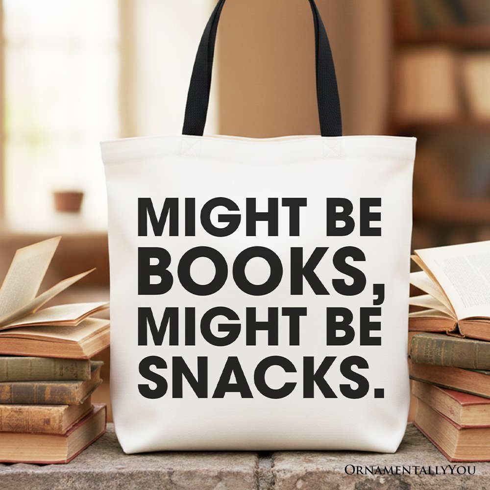 Minimalist canvas tote bag with the text 'Might be books, Might be snacks' in black on off-white fabric.