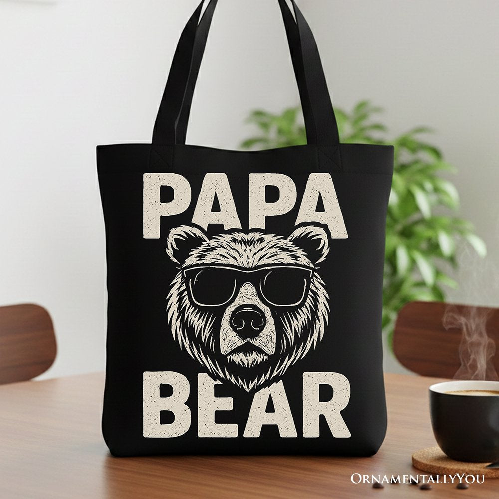 Black canvas tote bag featuring a Papa Bear sunglasses graphic design, perfect for dad.