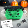 Small handmade Frankenstein crochet support doll in green and black yarn