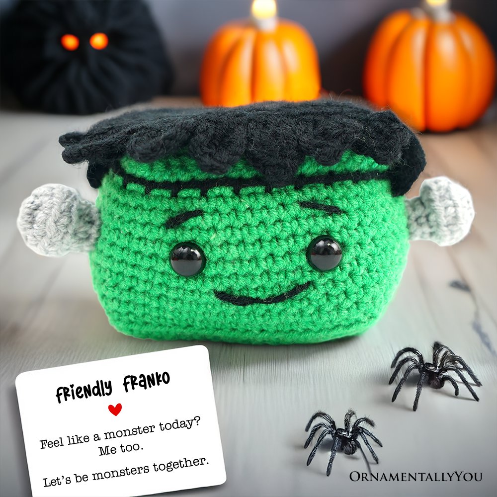 Small handmade Frankenstein crochet support doll in green and black yarn