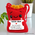 Vibrant red and yellow handmade Positive Nacho crochet support doll