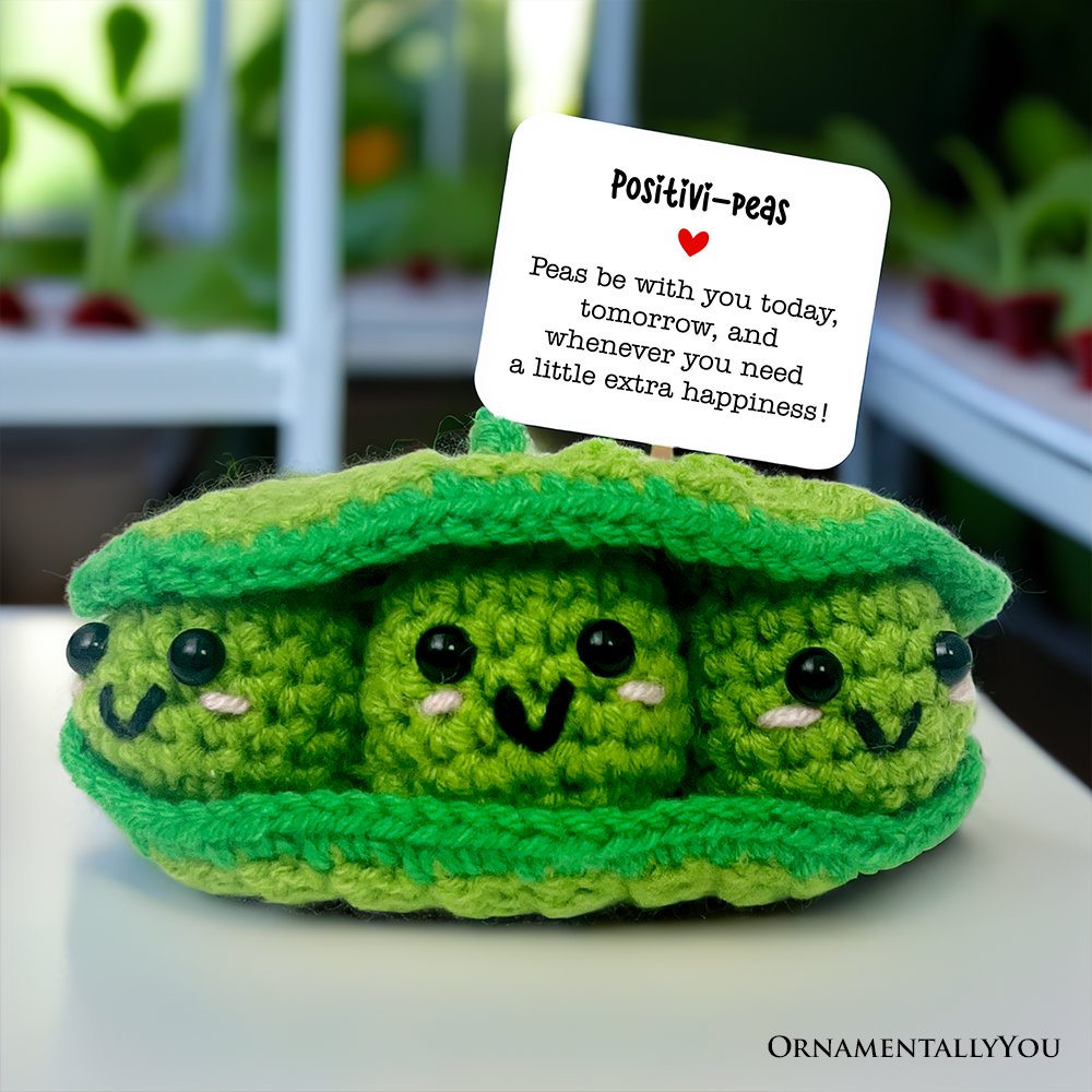 A handmade green Positivity Peas crochet support doll, a small knit comfort toy for encouragement.