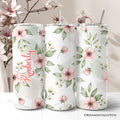 20oz stainless steel tumbler with soft pink wildflower pattern, includes lid and straw