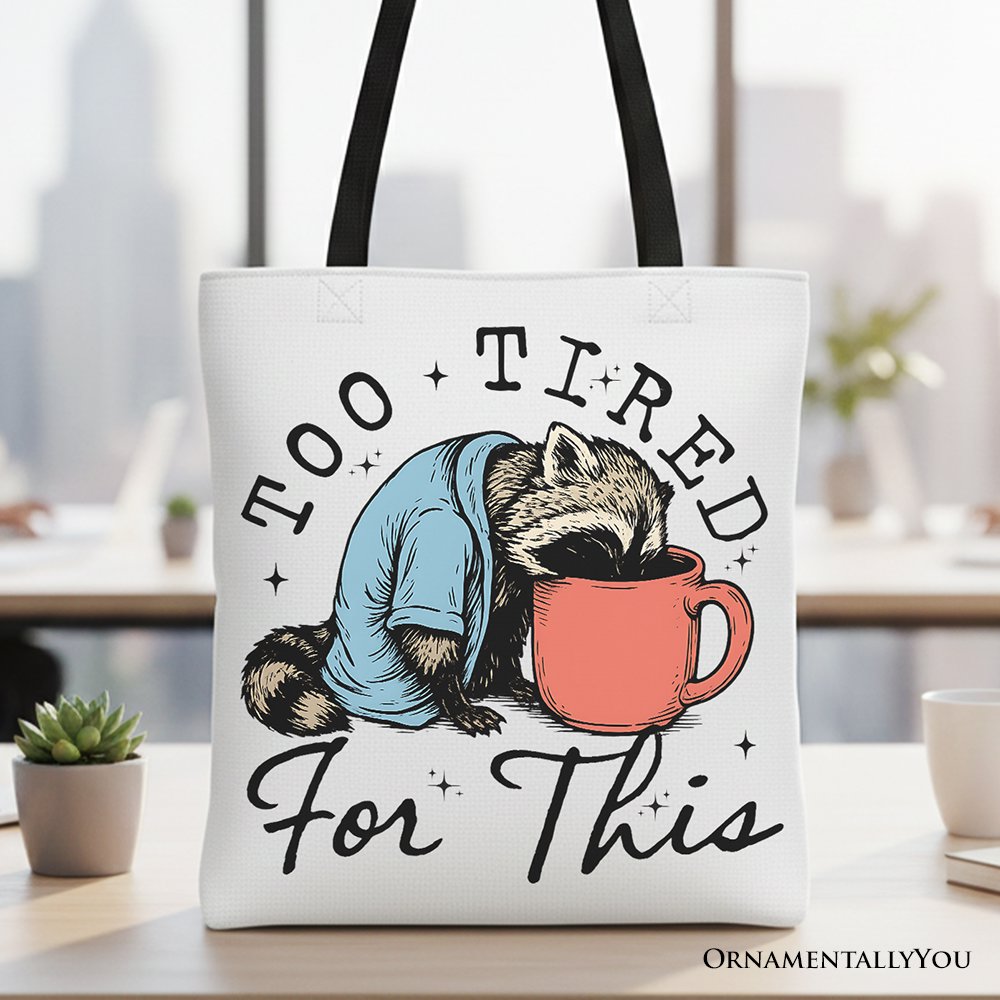Minimalist black and white canvas tote bag with a funny raccoon design saying Too Tired For This