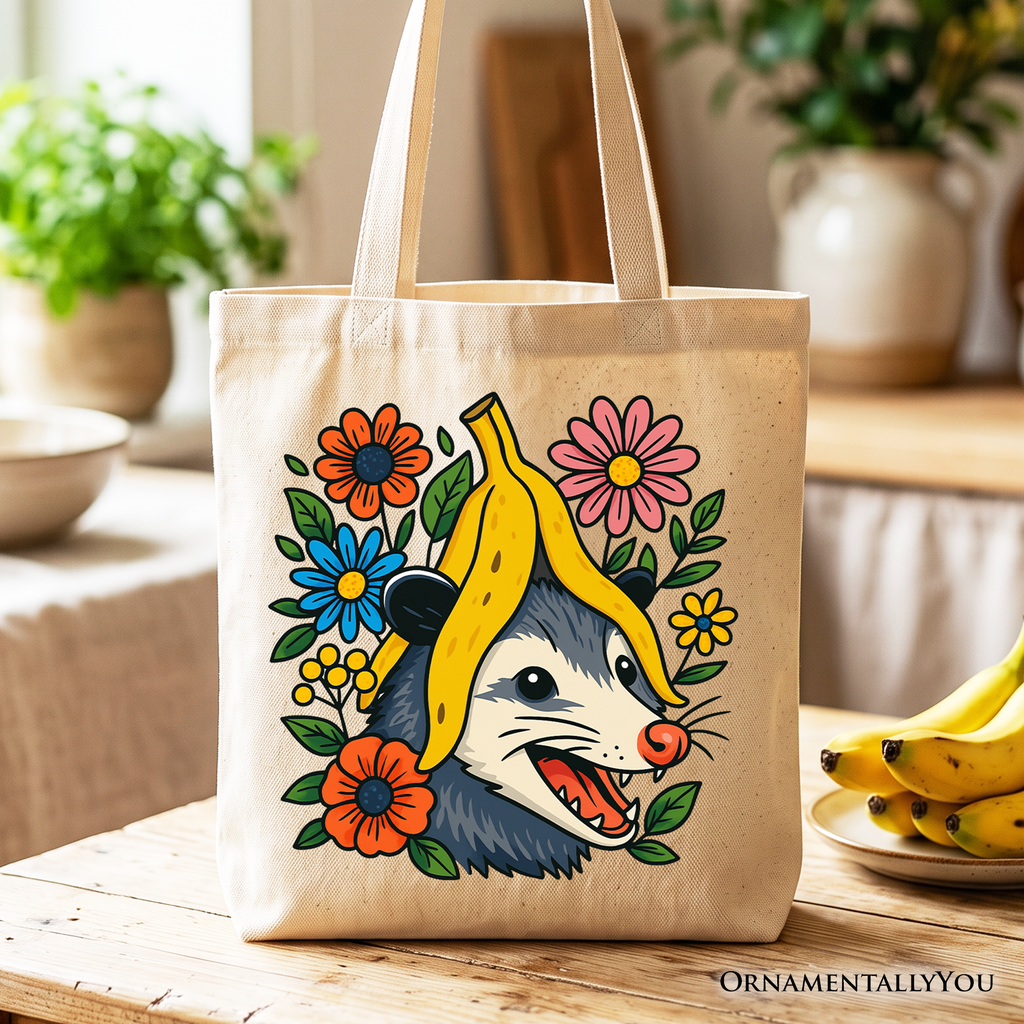 Beige canvas tote bag featuring a funny banana and possum floral graphic.