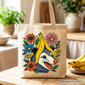 Beige canvas tote bag featuring a funny banana and possum floral graphic.
