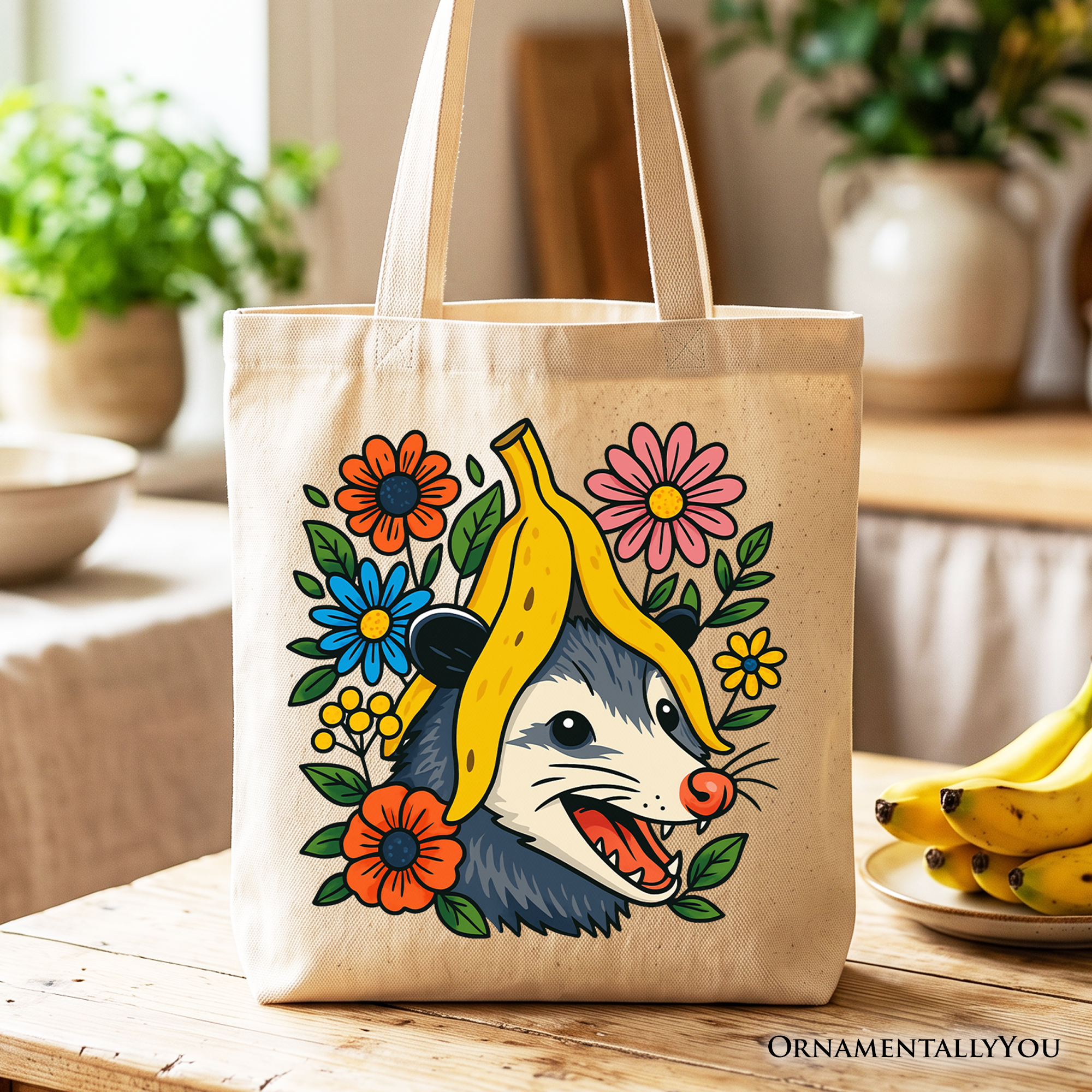 Beige canvas tote bag featuring a funny banana and possum floral graphic.