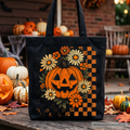 Retro checkered floral pumpkin graphic on a durable canvas tote bag for Halloween