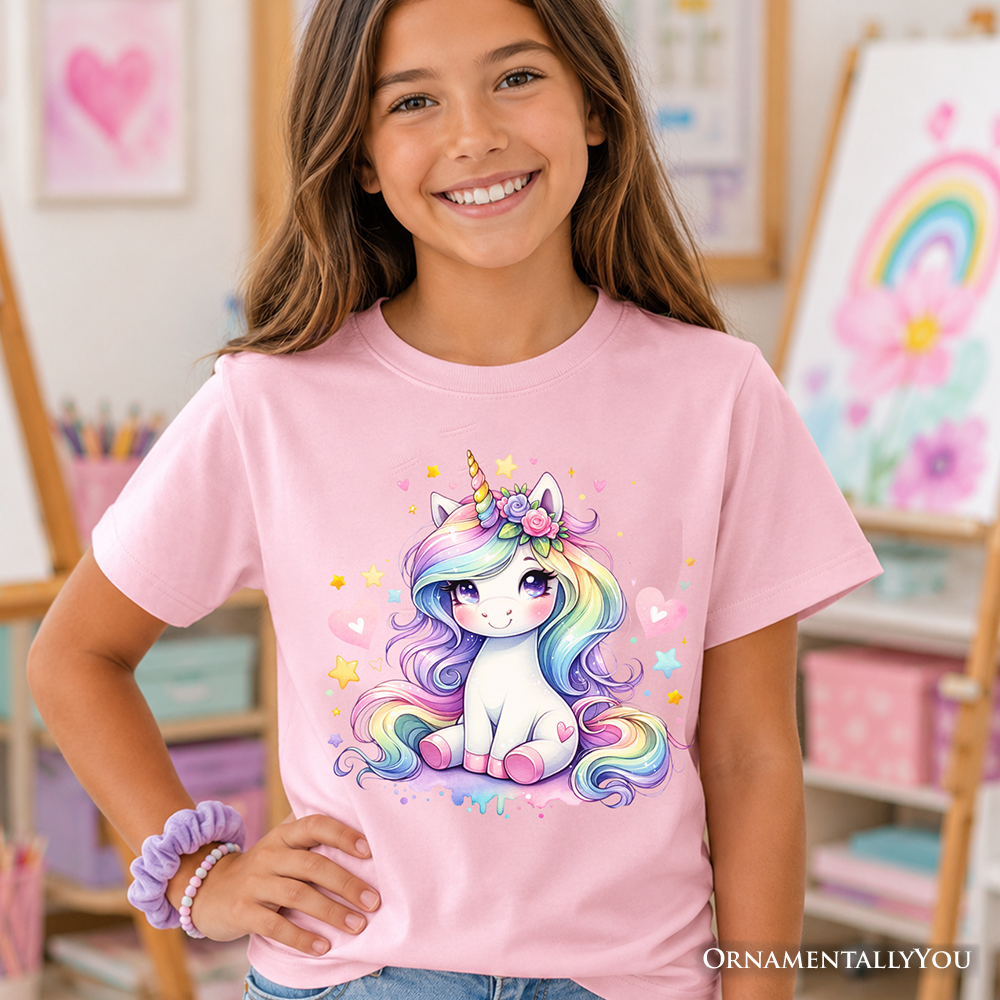 Pink and white kids t-shirt featuring a magical rainbow unicorn graphic