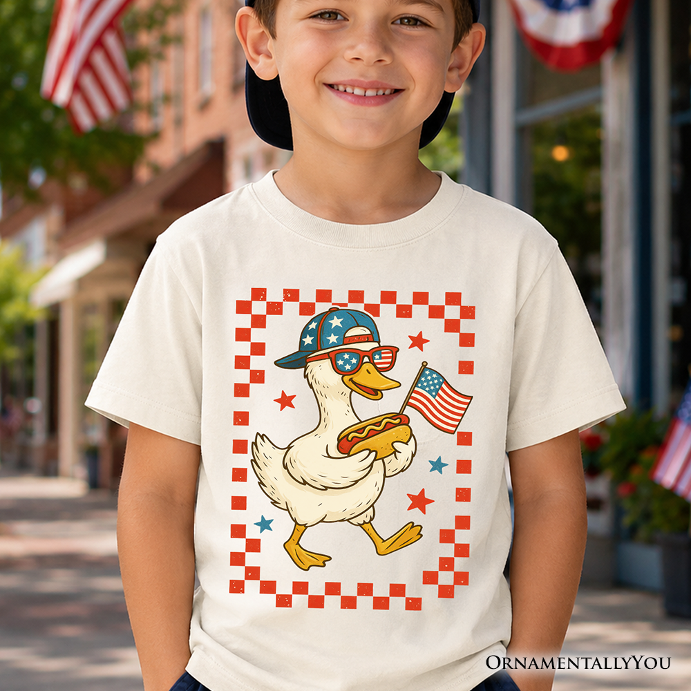 Child wearing a white graphic t-shirt with a patriotic duck design for 4th of July