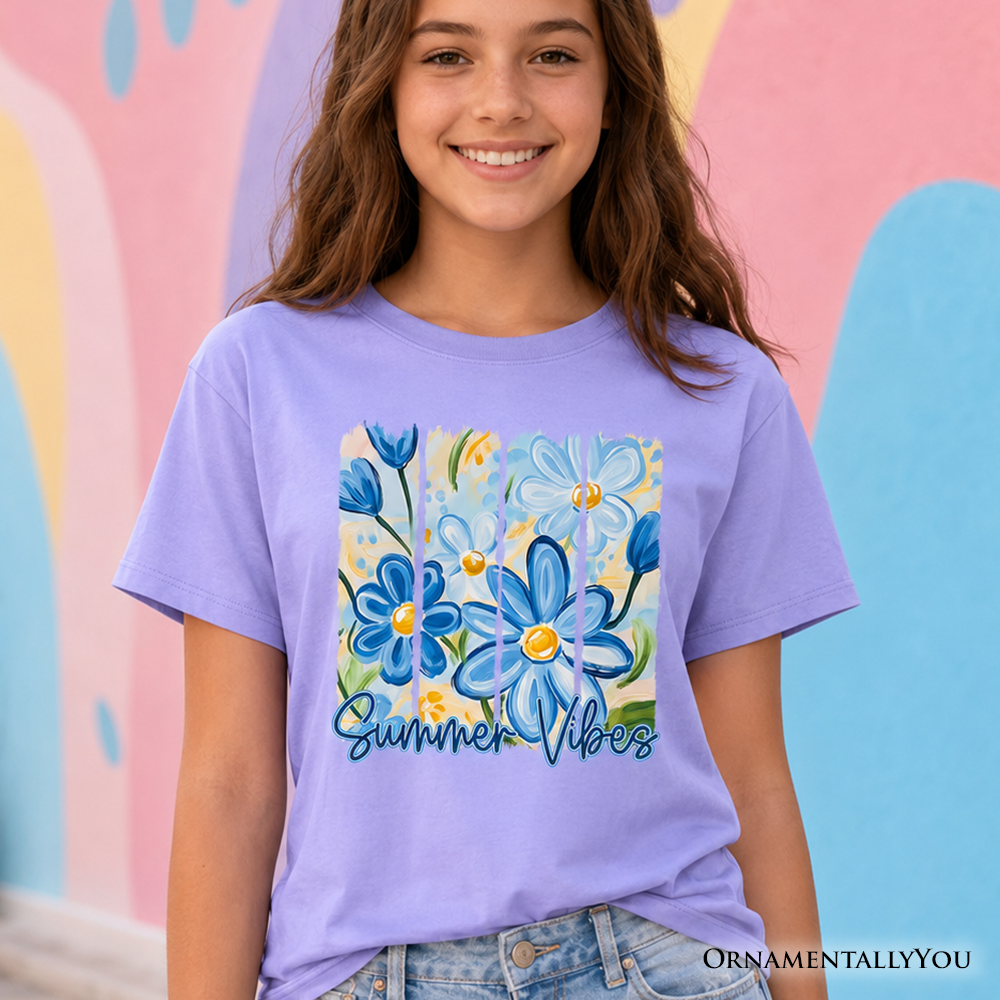 A child wearing a relaxed-fit light purple t-shirt with vibrant blue and yellow brushstroke floral patterns.