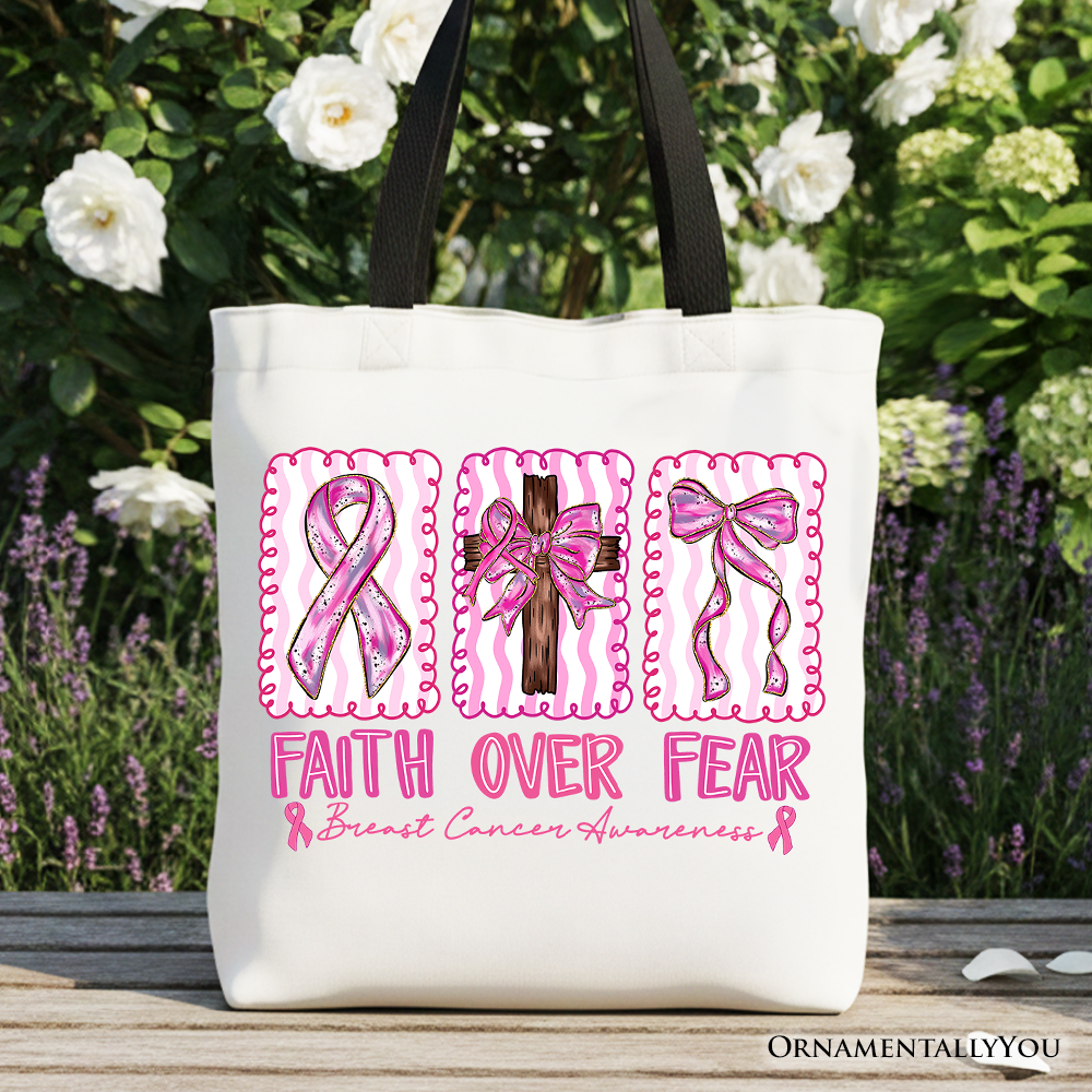 A pink ribbon breast cancer awareness tote bag with the text Faith Over Fear printed on the front.