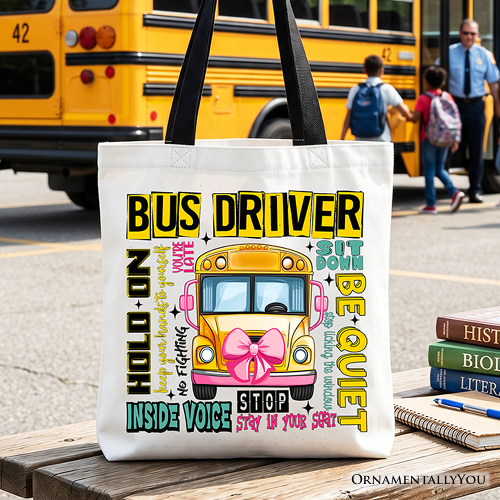 Funny school bus driver graphic on a white cotton canvas tote bag with yellow and pink accents.