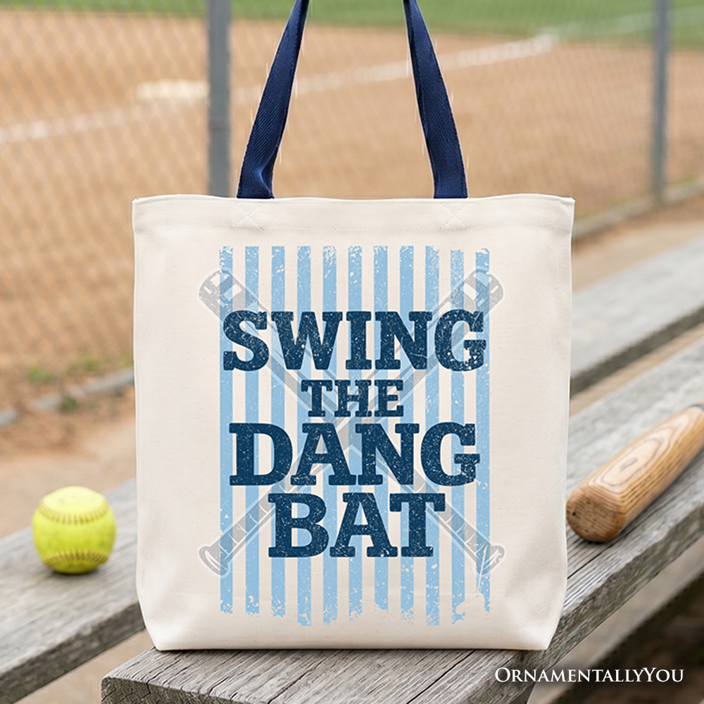 A durable canvas tote bag featuring the phrase Swing The Dang Bat for softball moms.