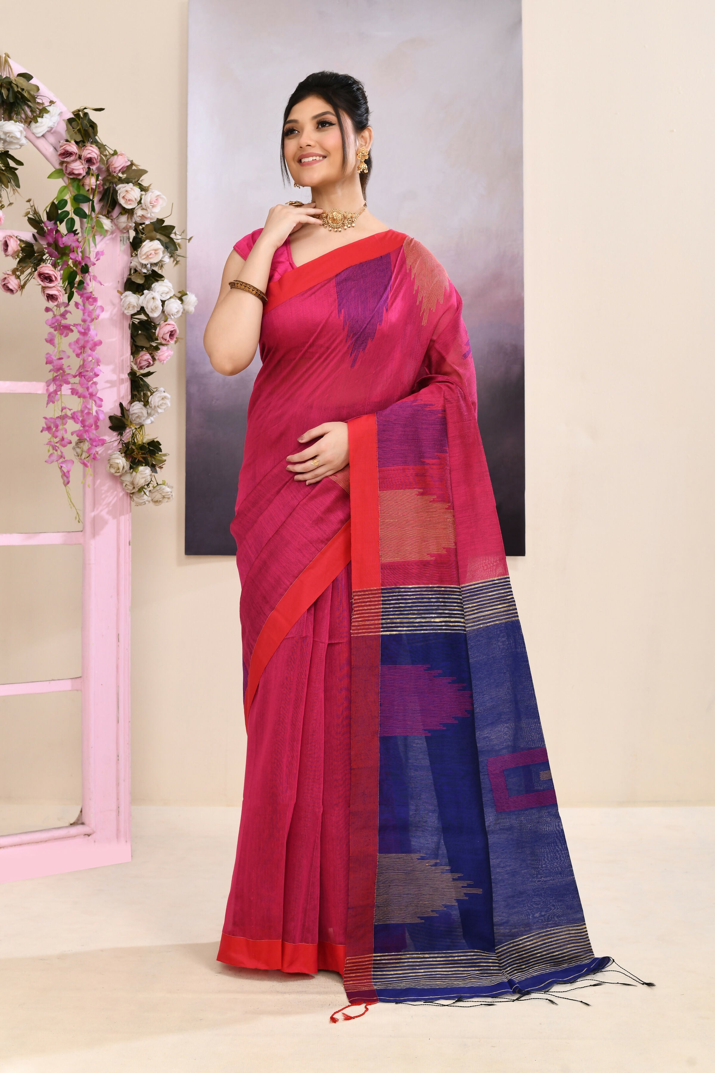 Pink Jamdani saree with traditional temple border and detailed embellishments