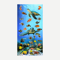 A colorful beach towel featuring a vibrant underwater scene with sea turtles, clownfish, and various coral reef creatures.