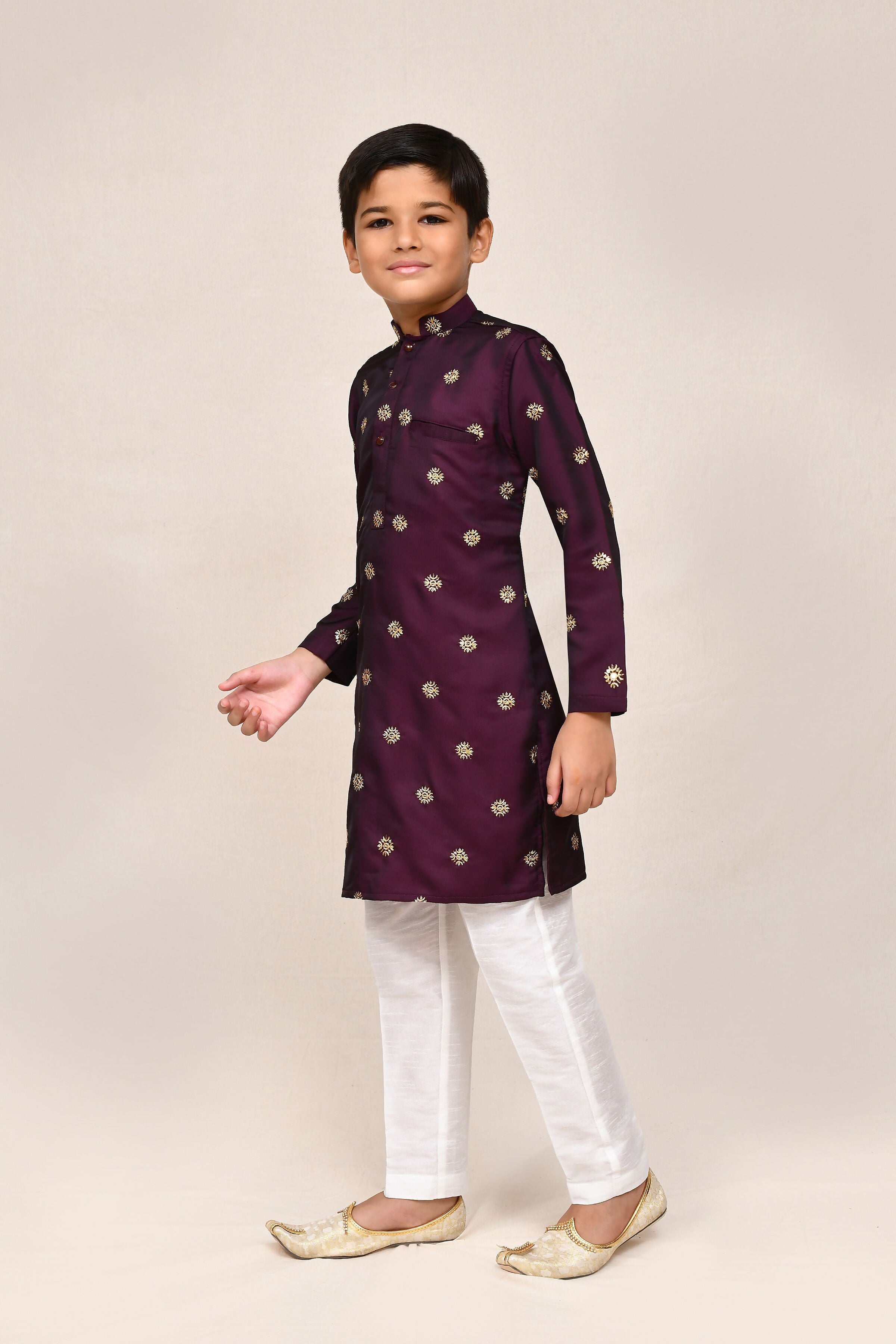 Magenta satin silk kurta paired with white straight-fit trousers for women