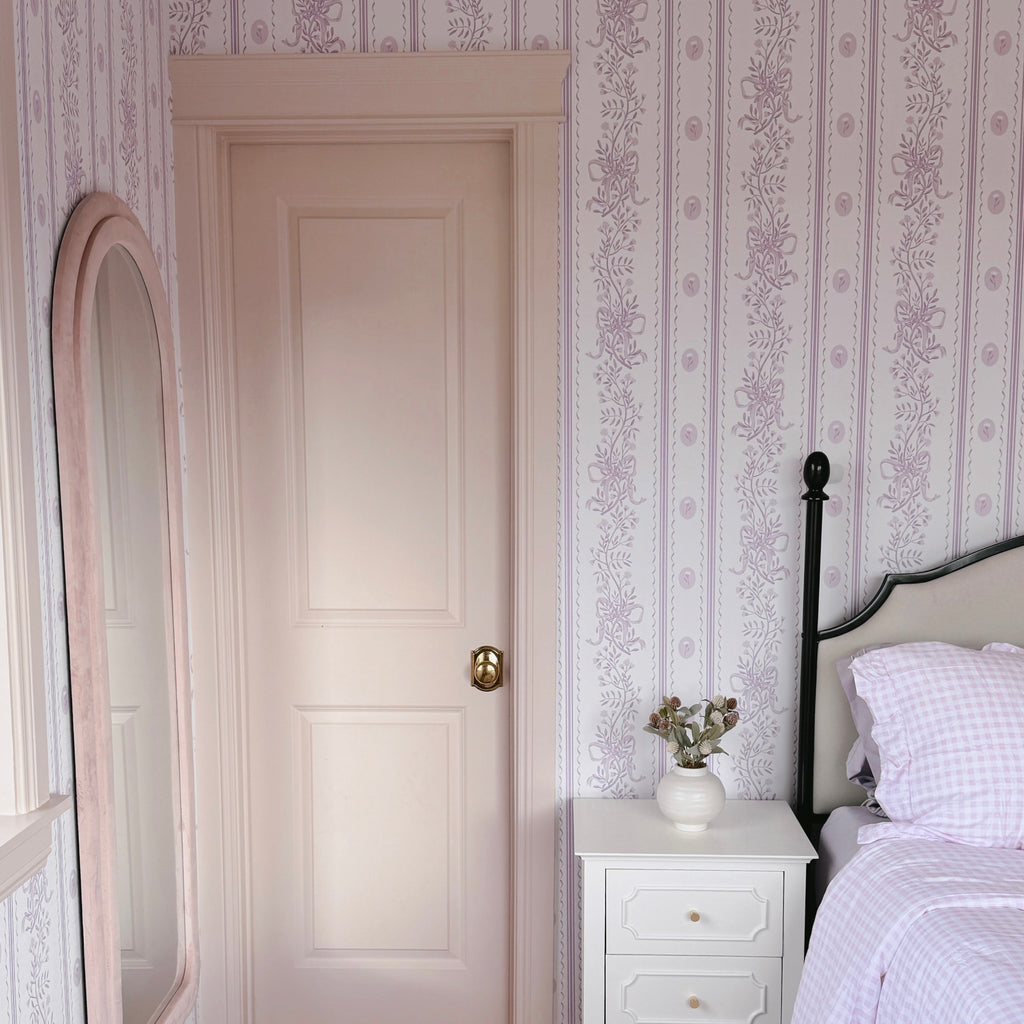 Close up of Dottie Floral Removable Wallpaper with pink, blue, and green vintage flower pattern