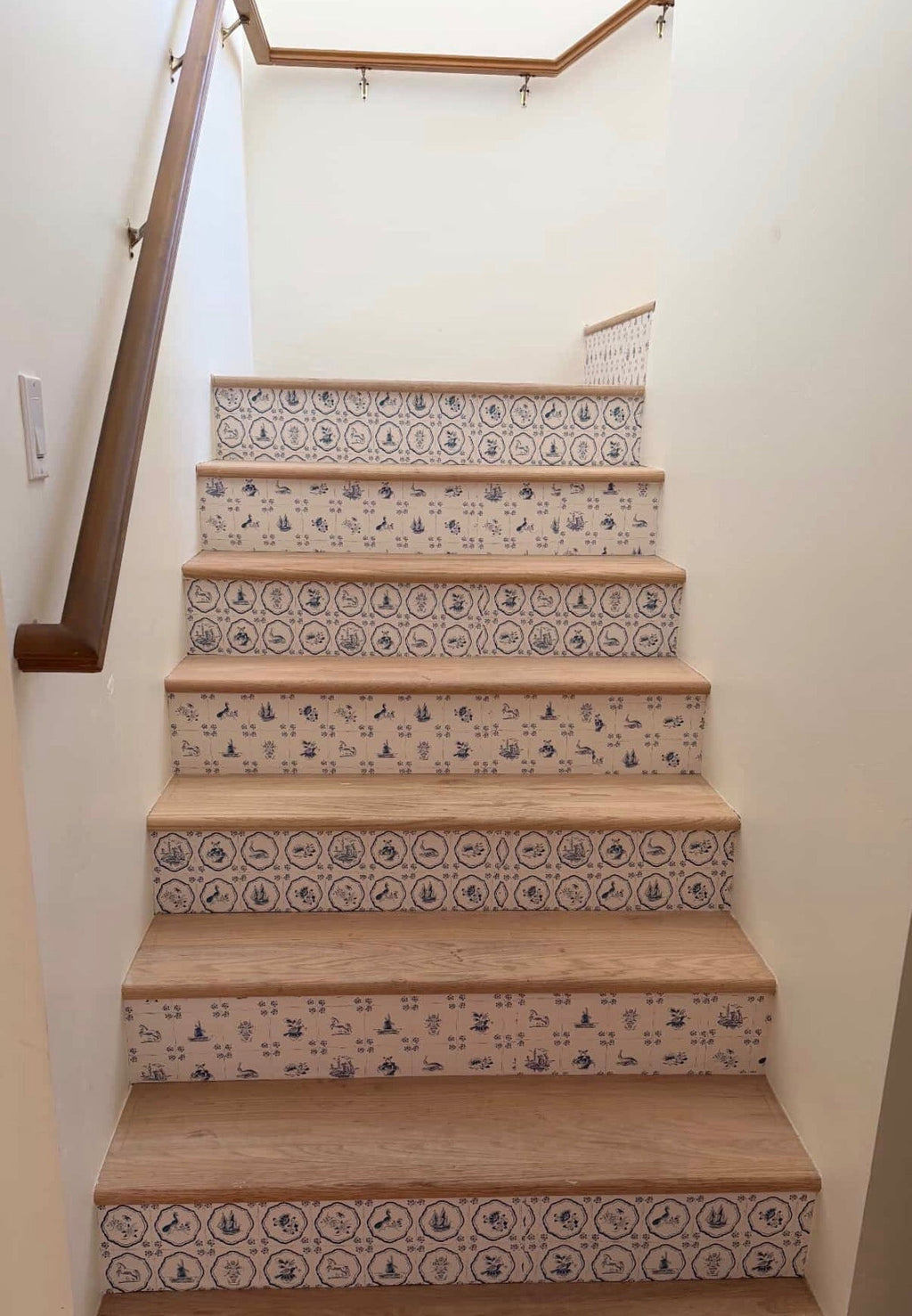Traditional cream and blue patterned wallpaper in a coastal farmhouse style room