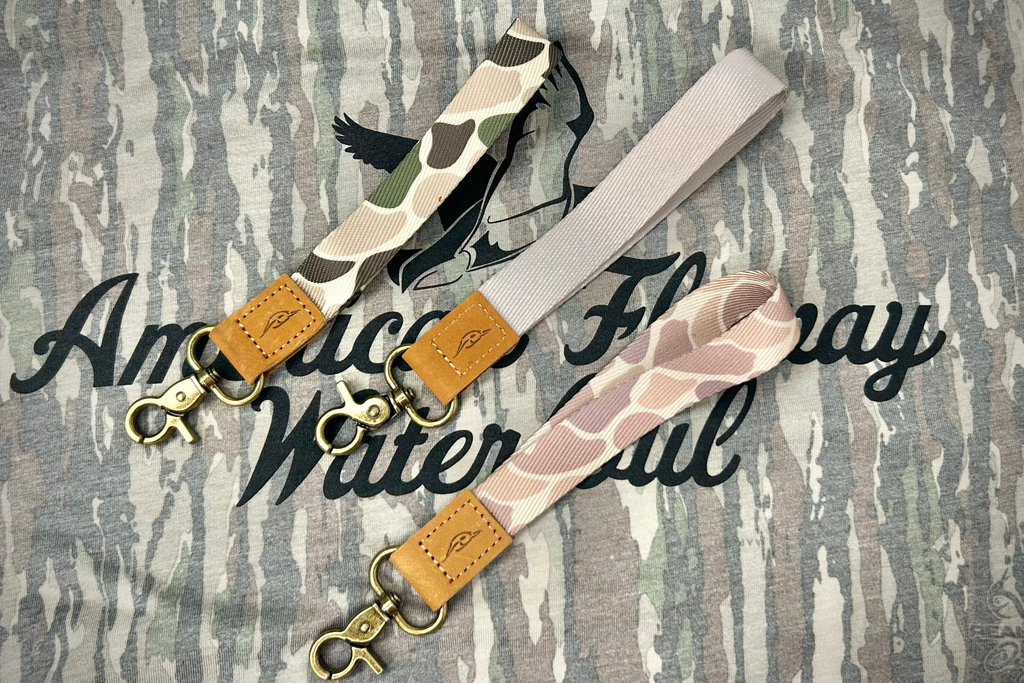 Durable abstract pattern wrist lanyard with leather AFW branding tag in multi-color and tan