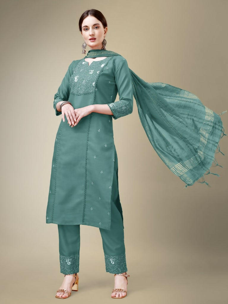 Women's teal cotton blend kurta set with intricate embroidery and fancy lace detail.