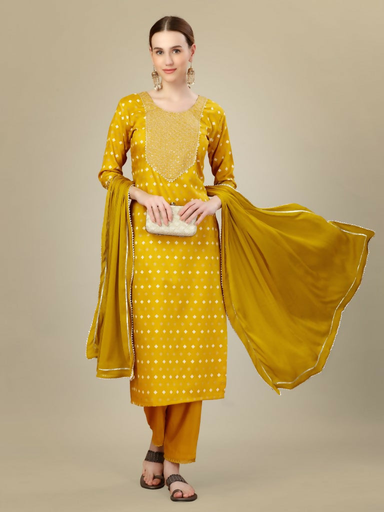 Golden silk blend straight kurta with intricate embroidery and sequence work, paired with trousers and dupatta