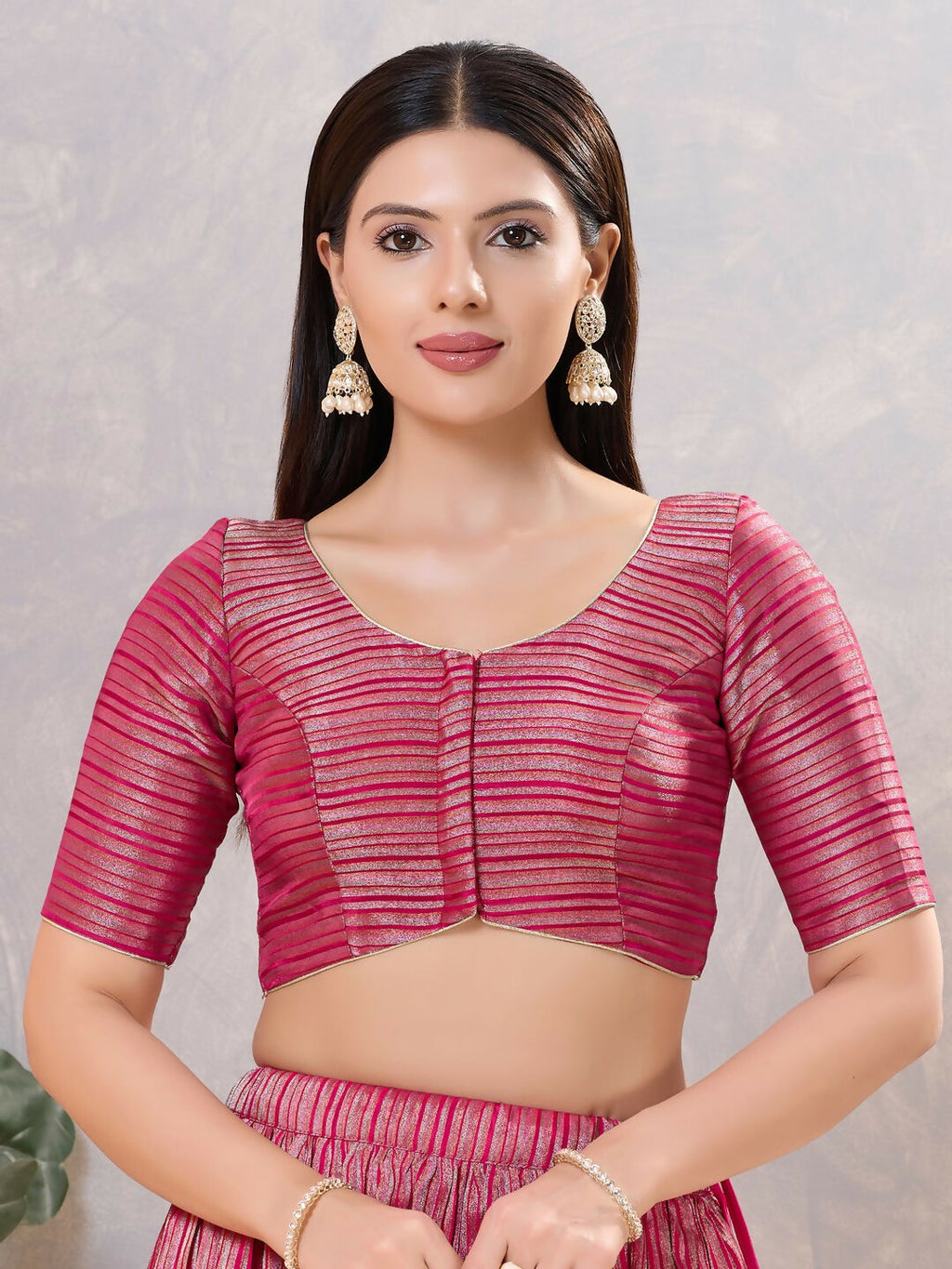 Close-up of a South-Pink silk stitched blouse with a V-neckline