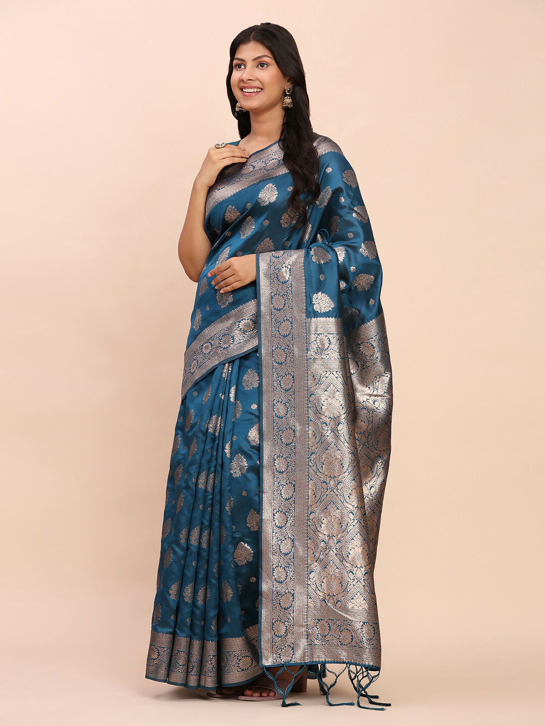 Teal Blue Banarasi Silk saree with matching blouse piece draped elegantly.