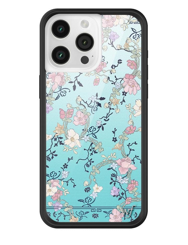 Gallery Girlie Blue iPhone case featuring a light blue background with a 70s Japanese-inspired floral print and a black rubber bumper.
