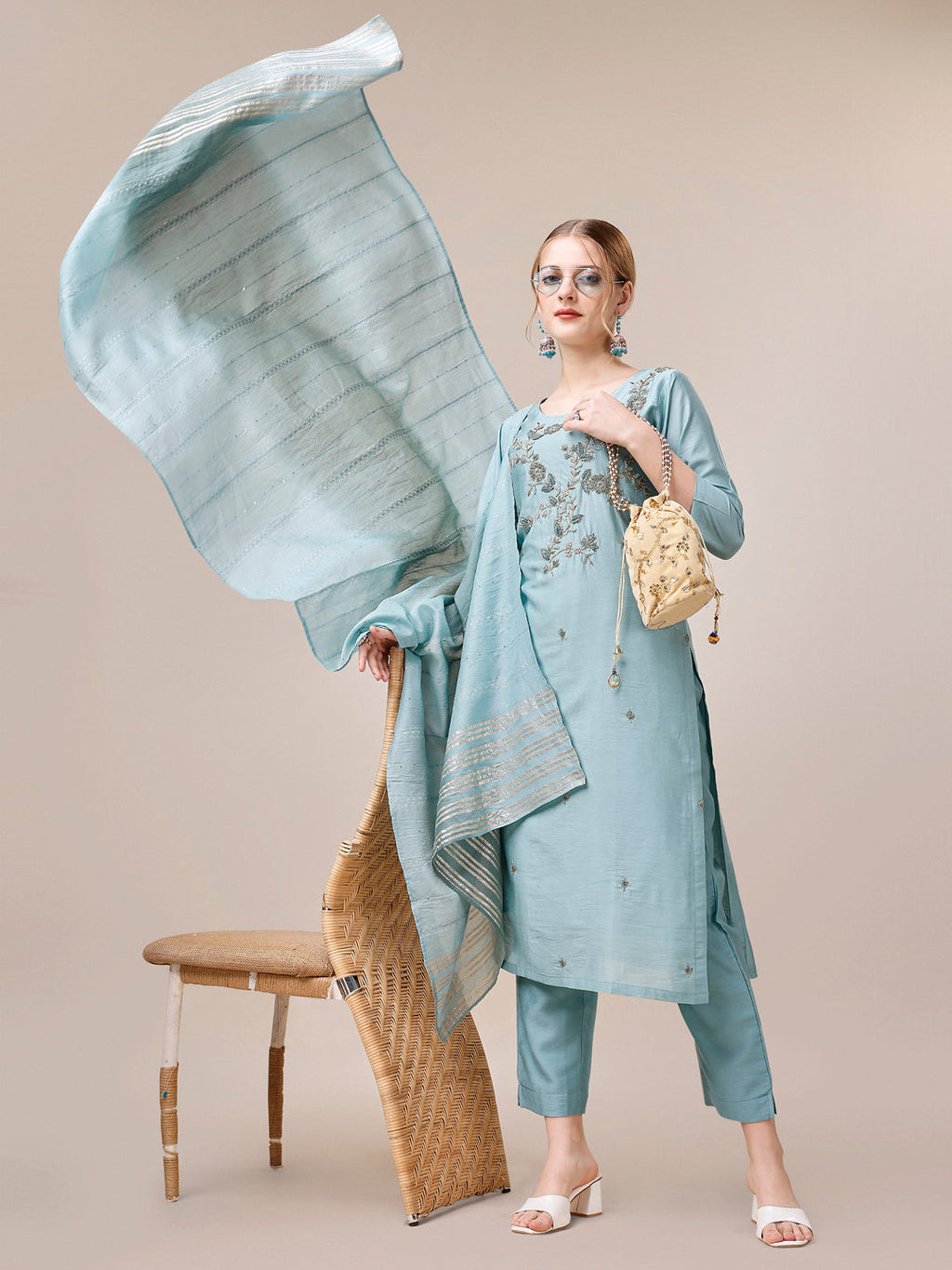 Hand embroidered multicolor rayon kurta set paired with matching trousers and dupatta