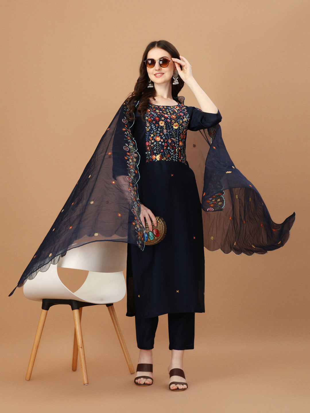 Multicolor embroidered kurta with matching pants and embroidered dupatta.