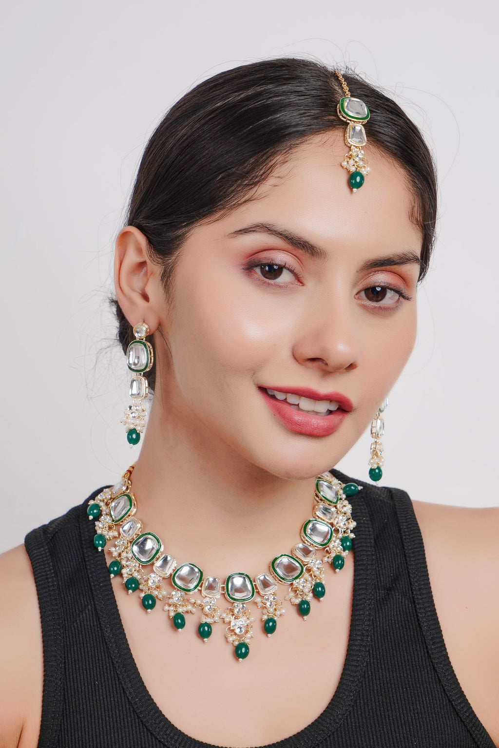 Elegant gold-plated green traditional jewellery set for women, featuring antique finish