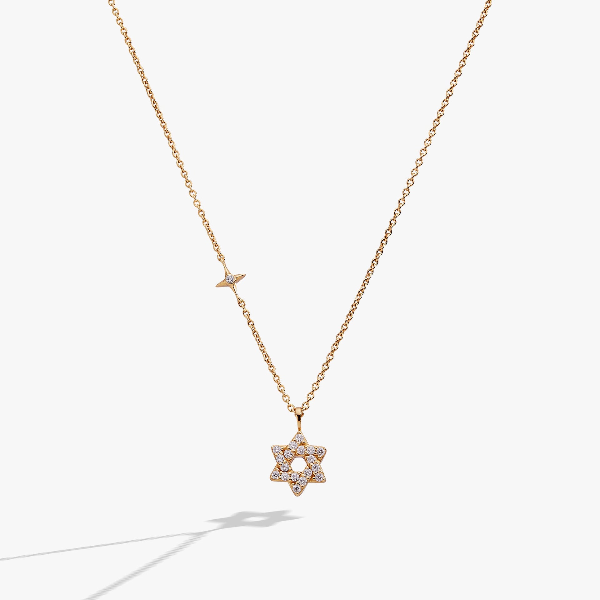 Gold-plated sterling silver Star of David pendant necklace with clear pave crystals.