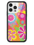 Close up of a vibrant retro-style floral iPhone case with pink, yellow, and green flowers, featuring a black bumper and silver logo emblem.